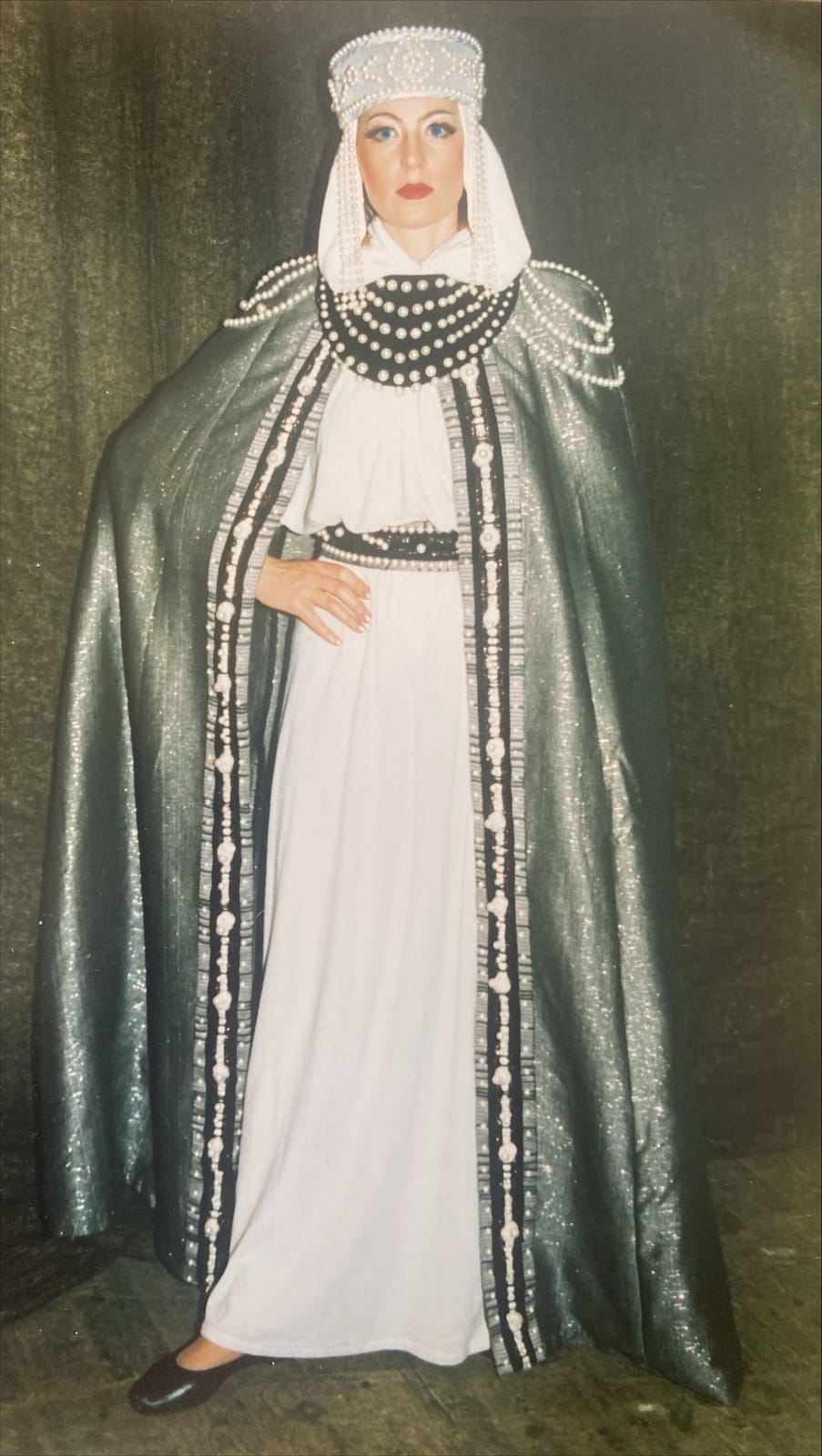 Archival role photograph: white gown with a silver cape and a pearl-trimmed kokoshnik headdress.