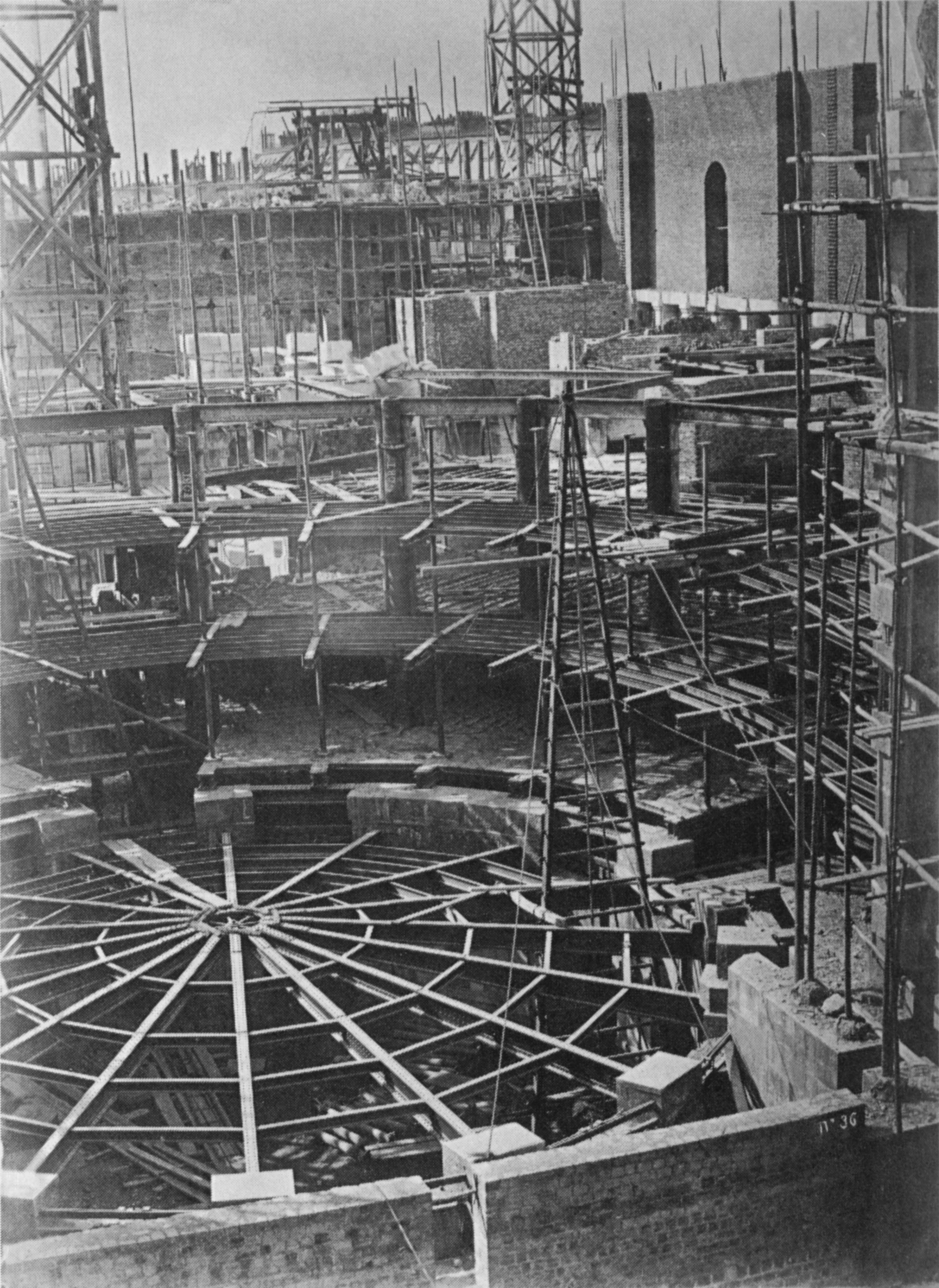 Construction photograph of the Palais Garnier auditorium in 1865: bare brick, scaffolding and ironwork where the hall now stands.