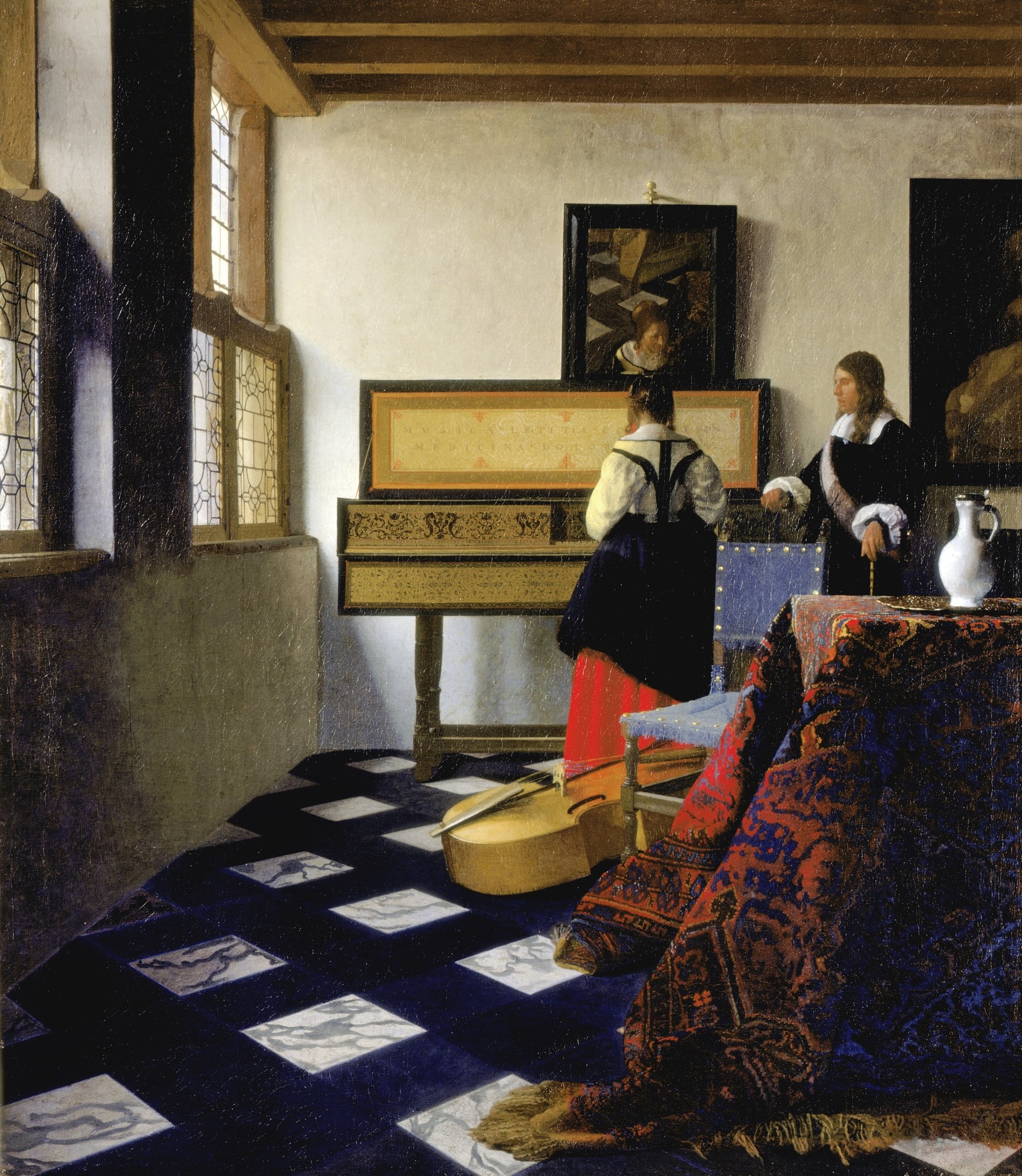 Vermeer’s painting The Music Lesson: a young woman at the virginal with her teacher standing beside her.
