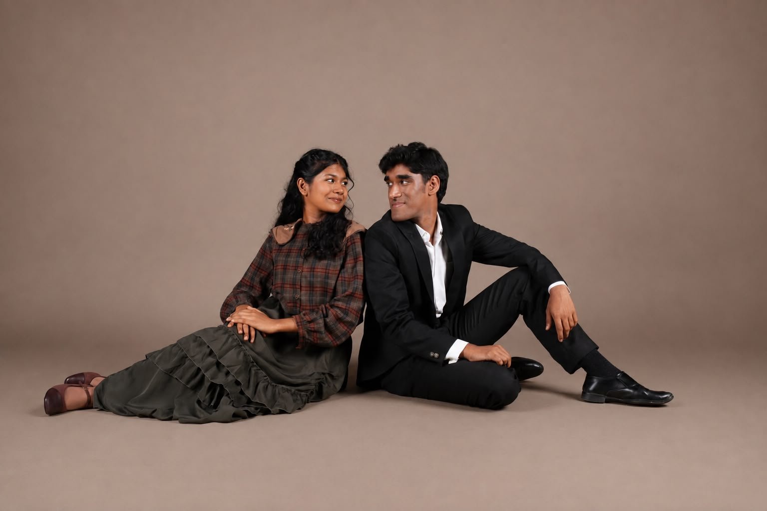 Two performers from Little Women, seated together