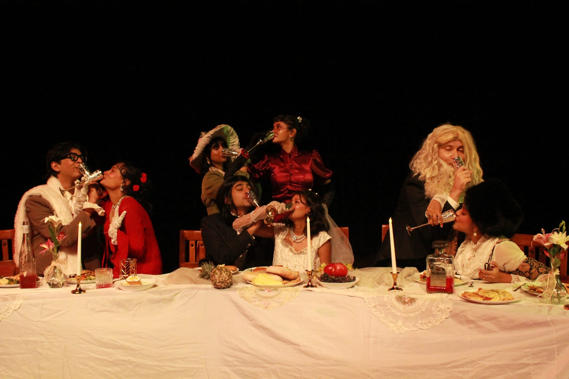 Scene from The Wedding: guests around the wedding banquet table
