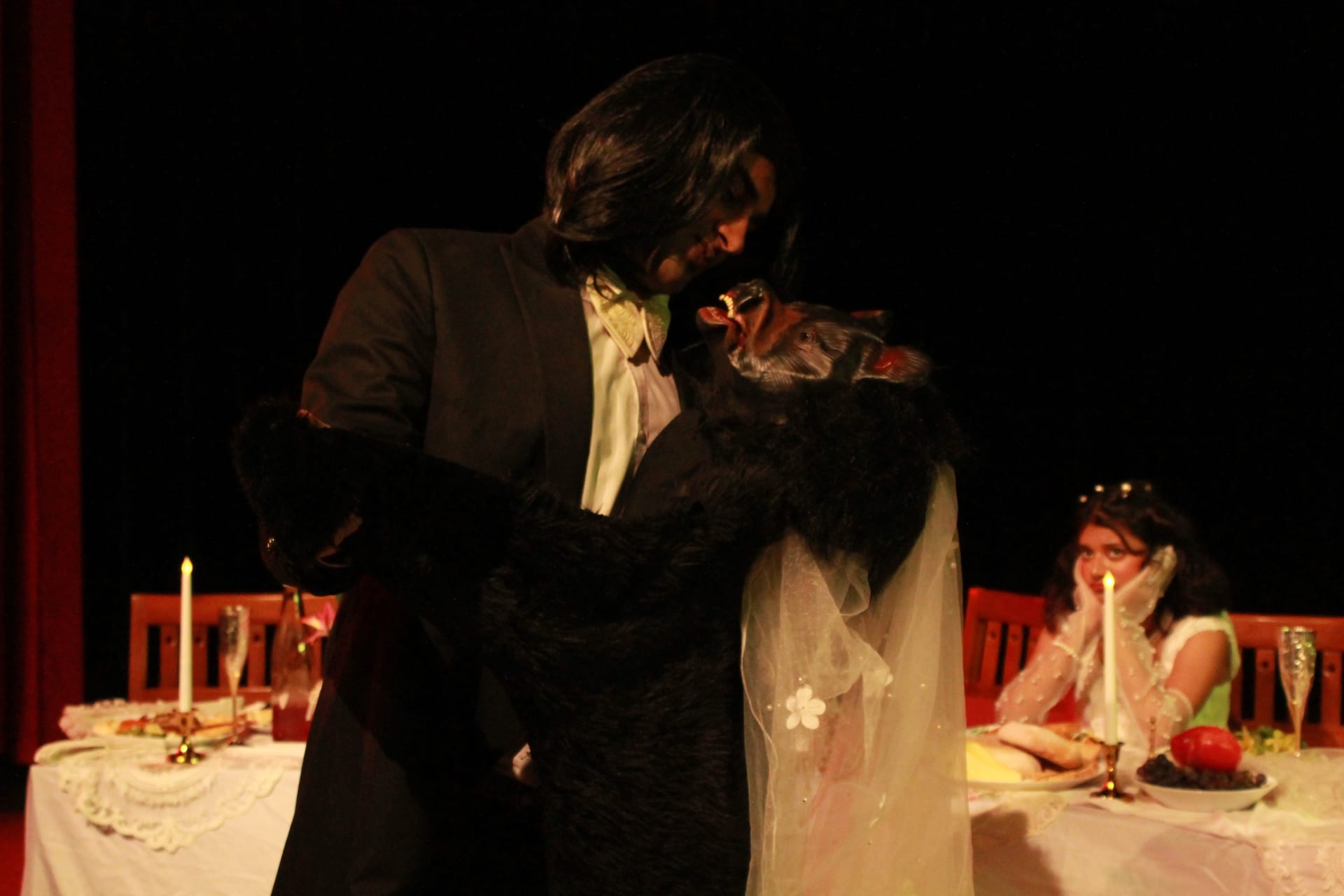 The bride and groom at the wedding table in Chekhov’s The Wedding