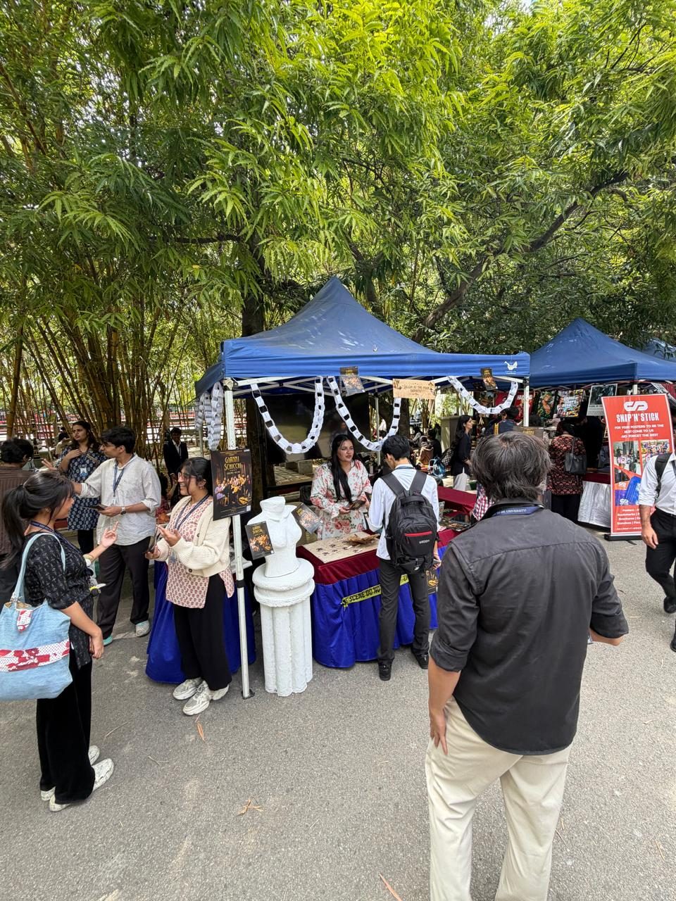 The Gianni Schicchi stand under the trees on Central Campus, CHRIST University.